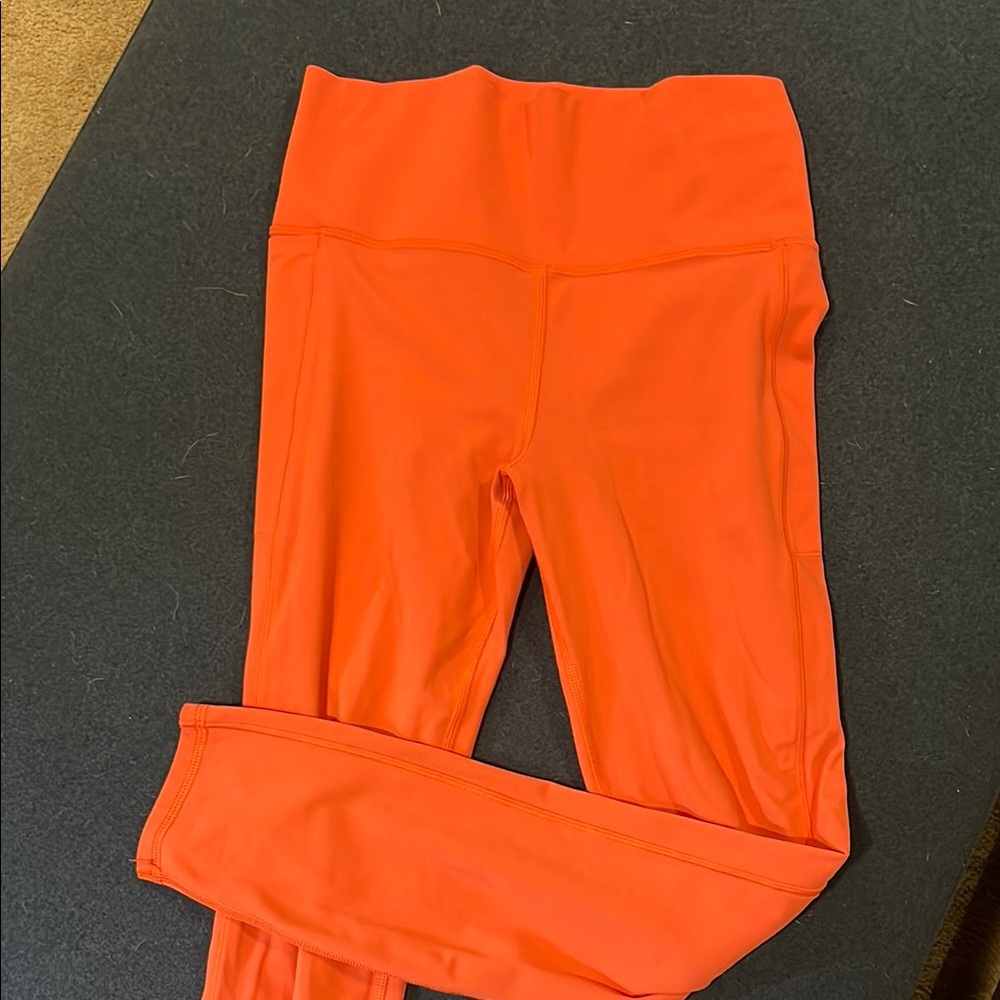 Orange Vuori 7/8 leggings with pockets